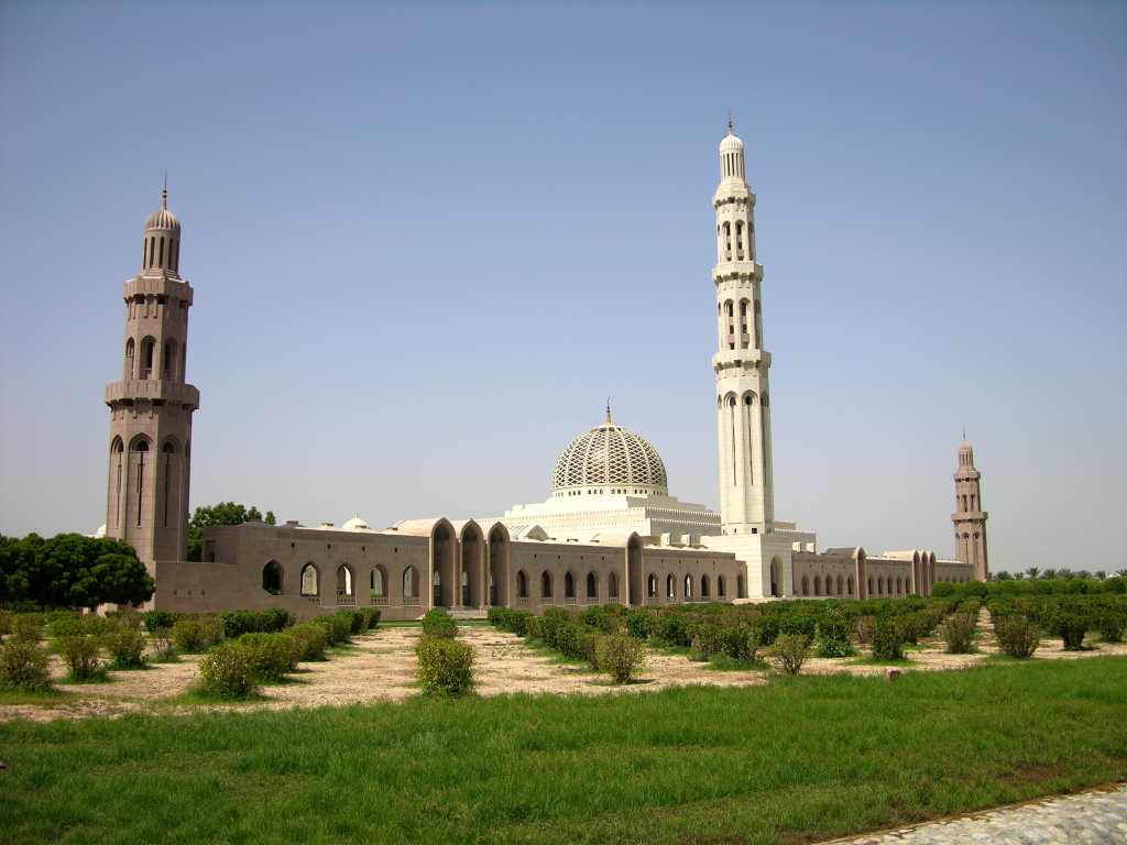 Muscat 04 Grand Mosque 01 Full View Outside The Sultan Qaboos Grand Mosque is the third largest in the world, built between 1995 and 2001 from 300,000 tons of Indian sandstone. The complex is 1000m long and 885m wide. The most visible part of a mosque is the minaret, the tower from which the call to prayer is broadcast five times a day. There are four 45.5m minarets on the corners and a big central one of 91.5m, the five minarets symbolizing the five pillars of Islam.